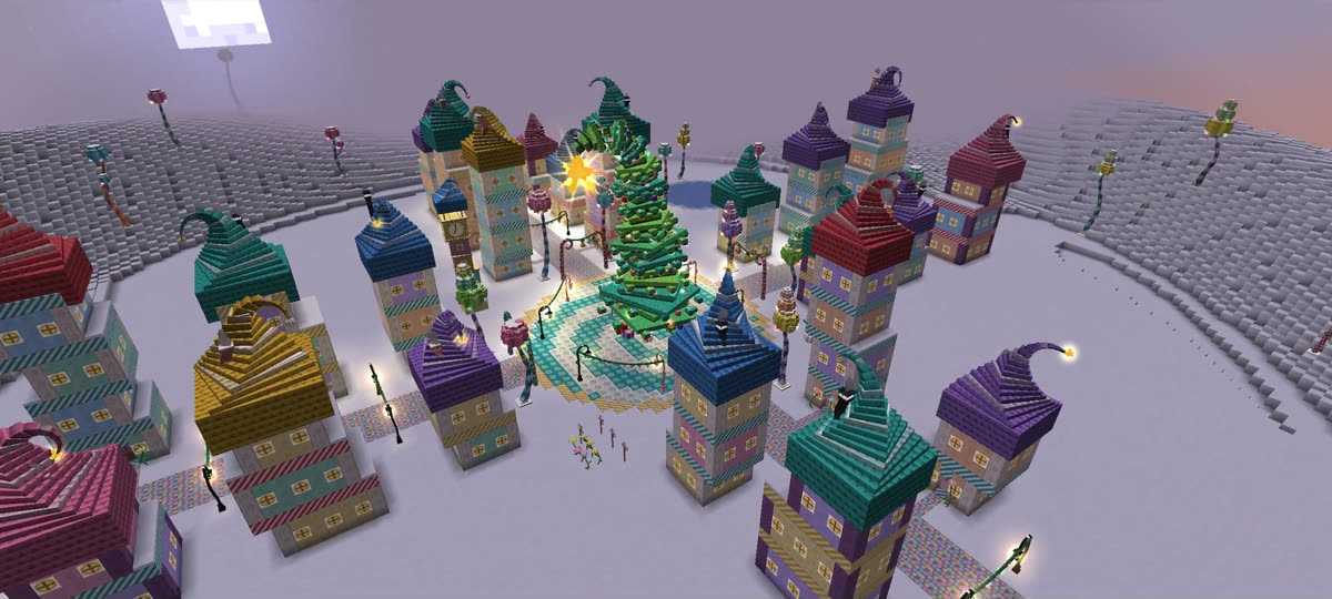 Who-Ville from above: candy-coloured houses around a glowing Christmas tree